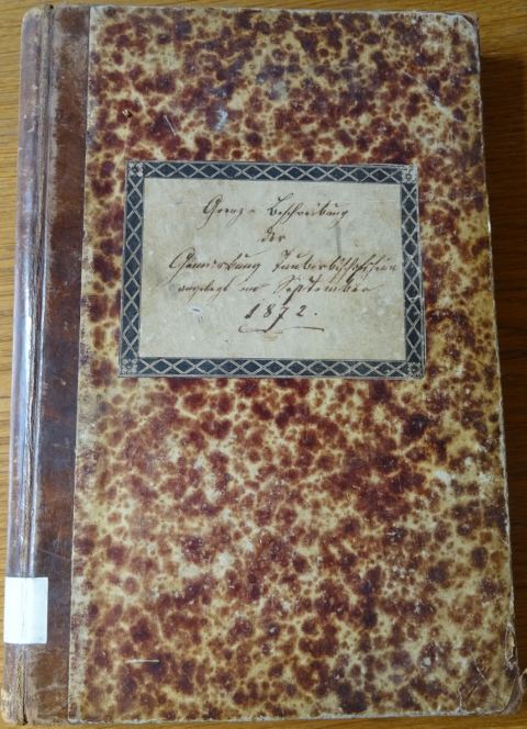 Einband der Grenzbeschreibung von 1872 mit Titelschild.